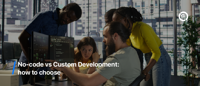 Team discussing app interface options on computer screen – no-code vs custom development decision-making in a modern office setting
